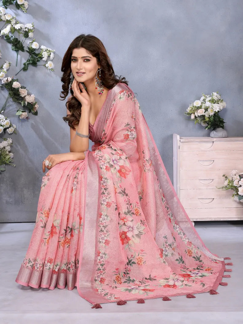 Woman wearing a pink floral saree with a gray background