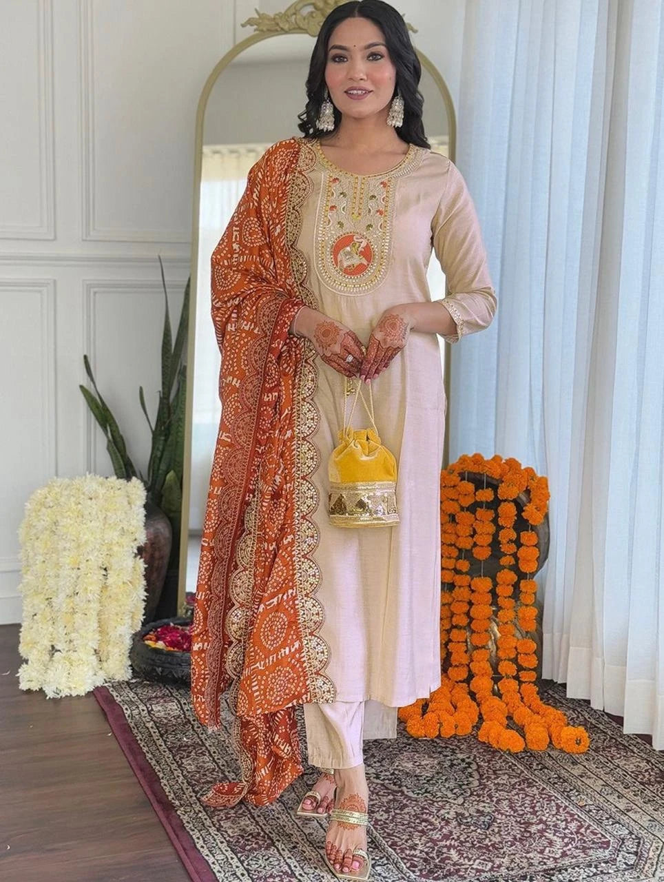 Woman in traditional outfit with decorative background