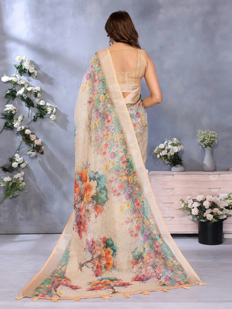Woman wearing a floral saree with a gray background and decorative flowers.