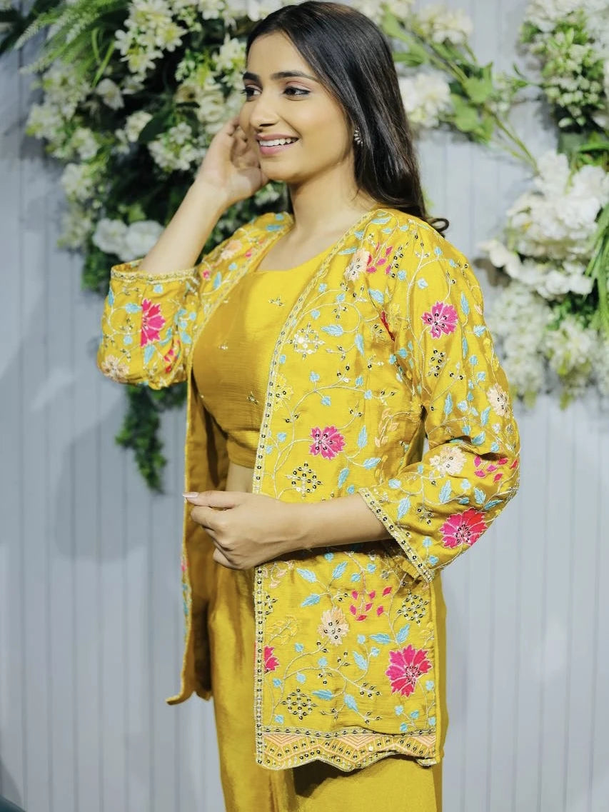 Woman wearing a yellow floral outfit with a decorative background