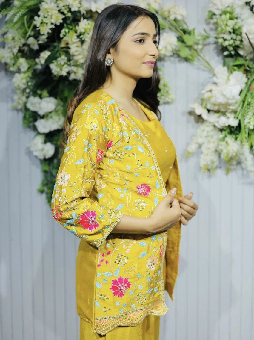 Woman wearing a yellow floral outfit with a decorative background