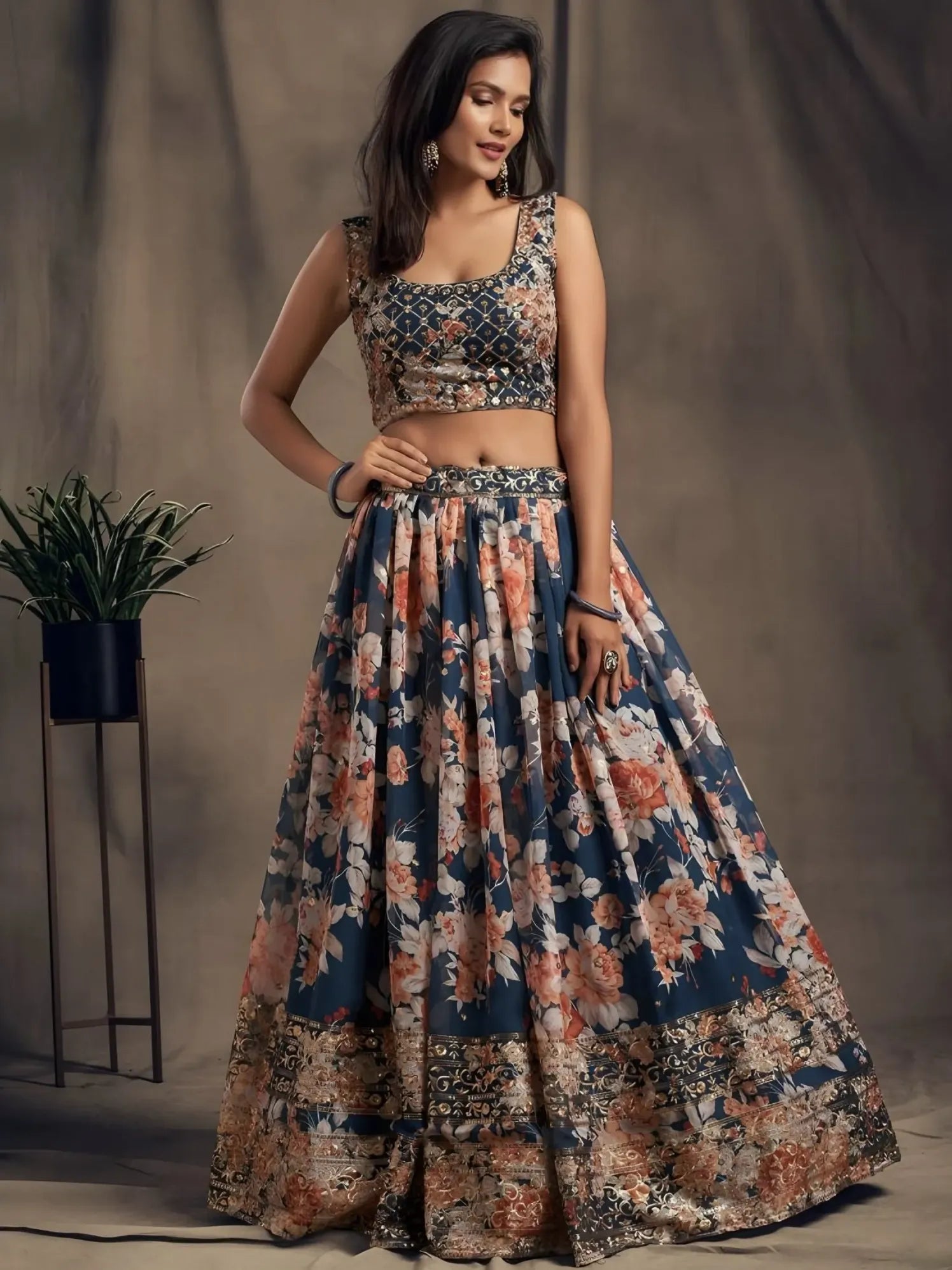 Woman wearing a floral dress against a plain background