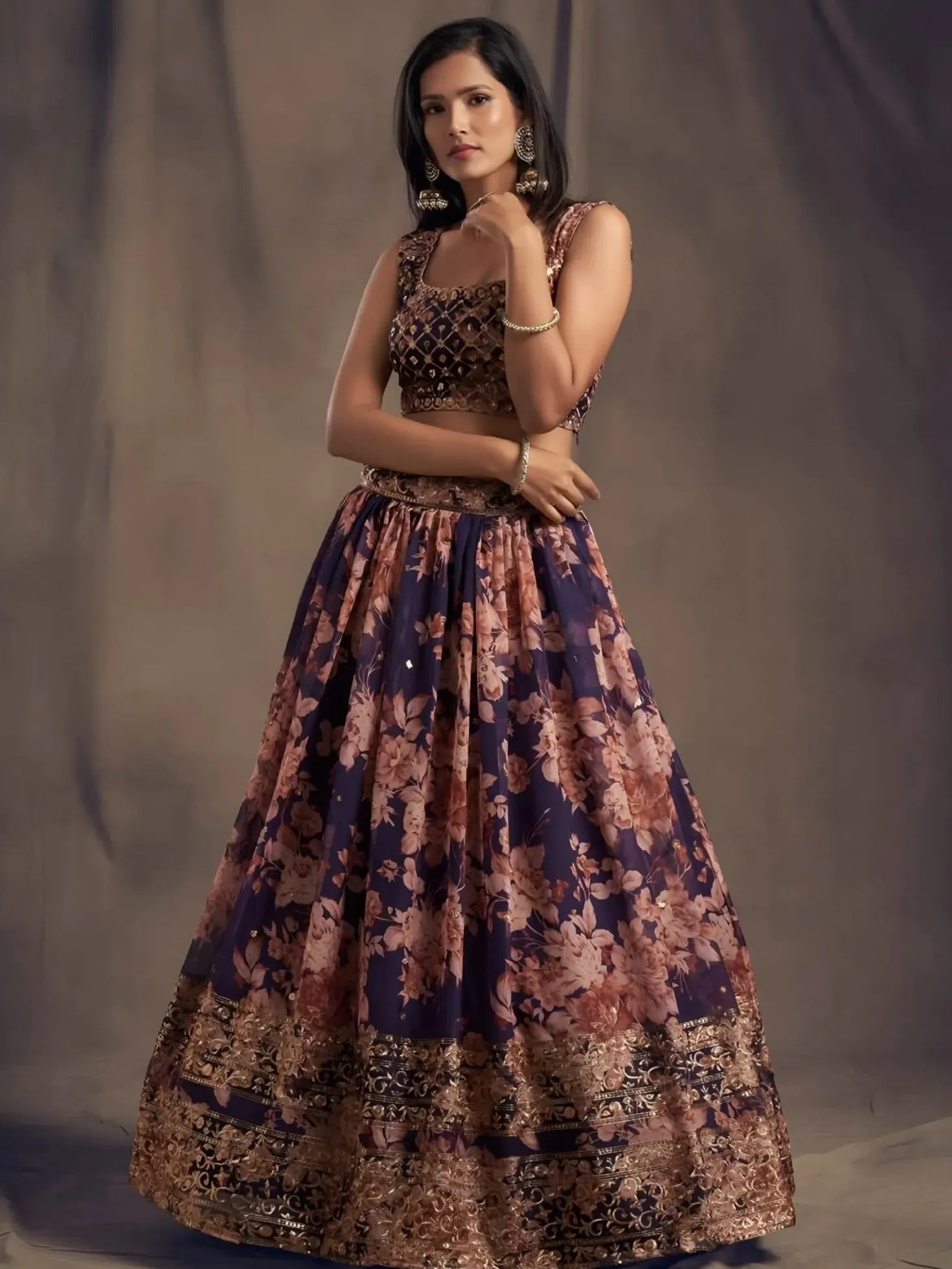 Woman wearing a patterned dress against a plain background