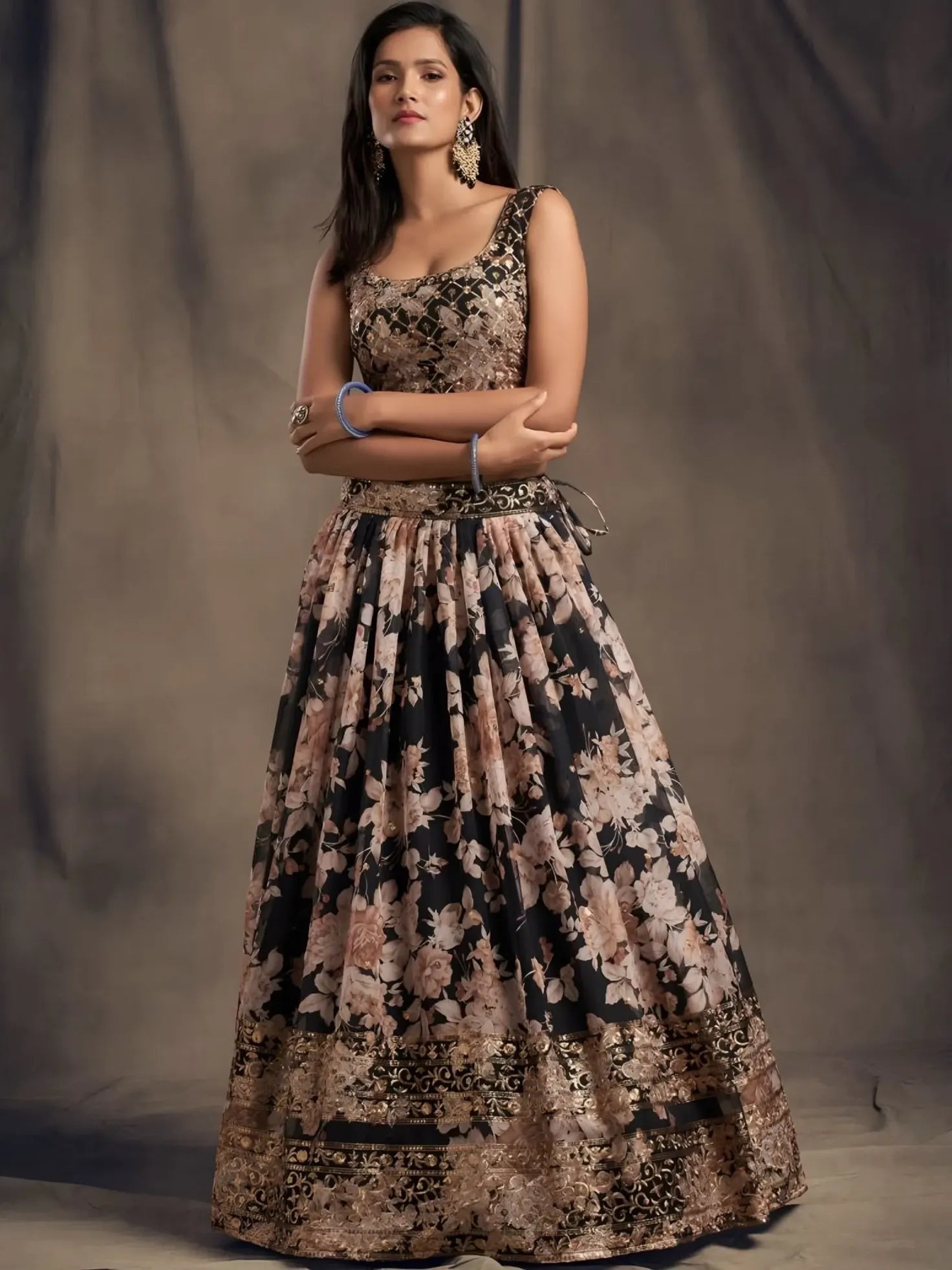 Woman wearing a floral dress against a plain background