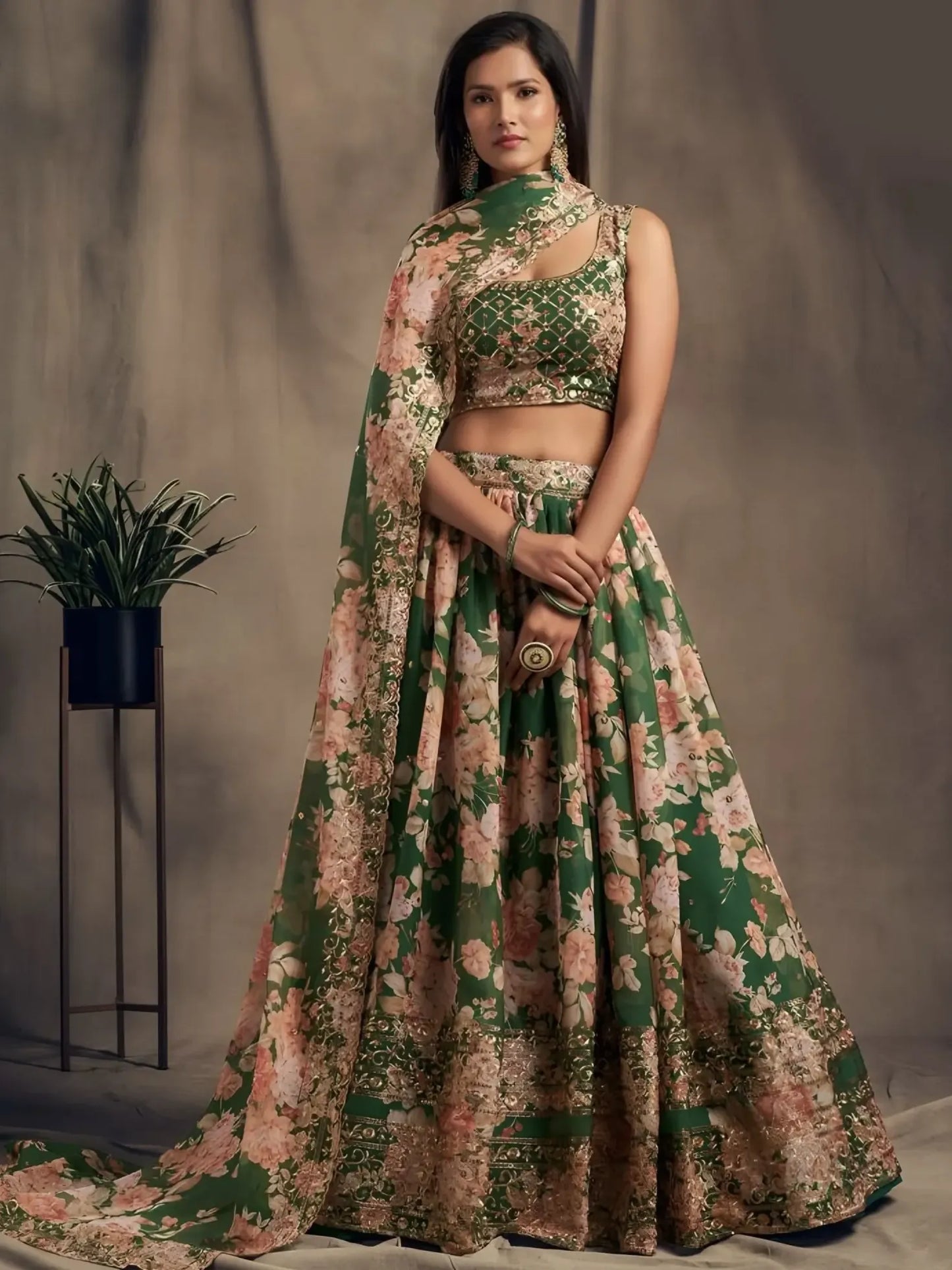 Woman wearing a floral traditional outfit with a plant in the background