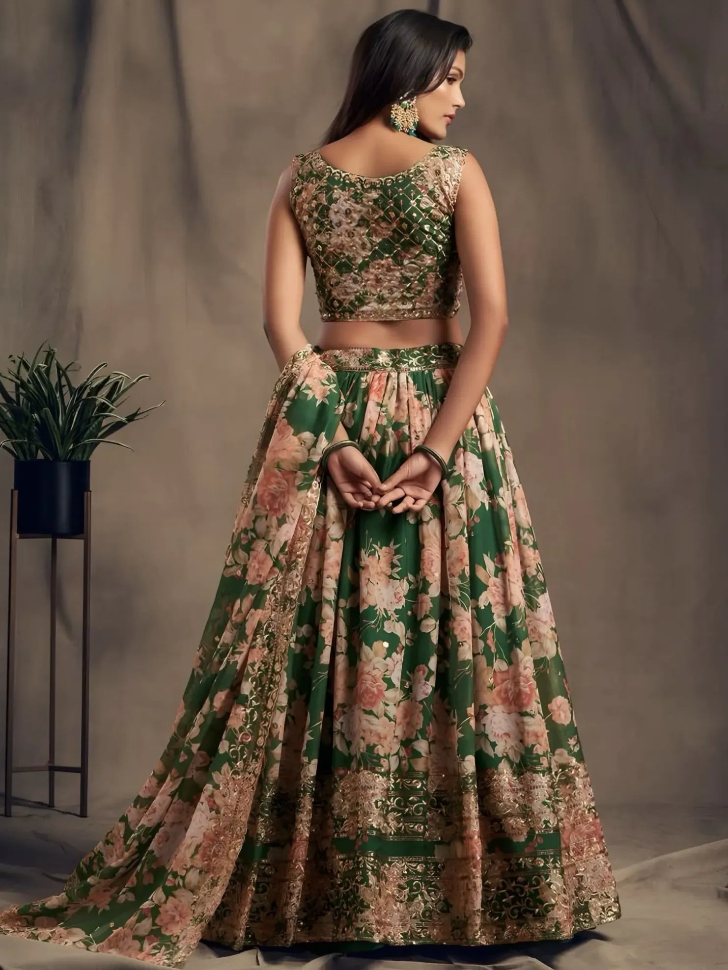 Woman wearing a floral two-piece outfit with a neutral background