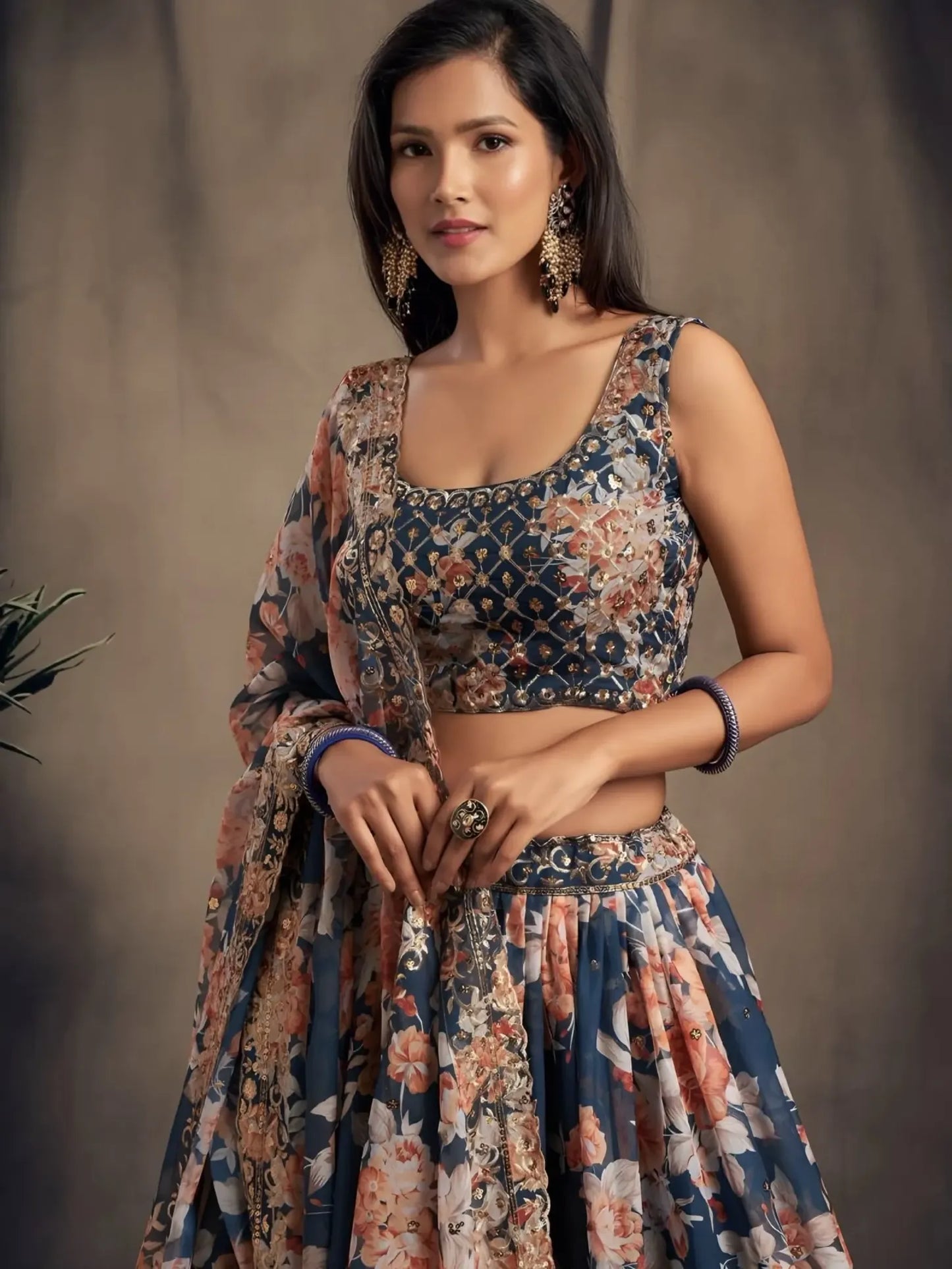 Woman wearing a floral dress against a neutral background