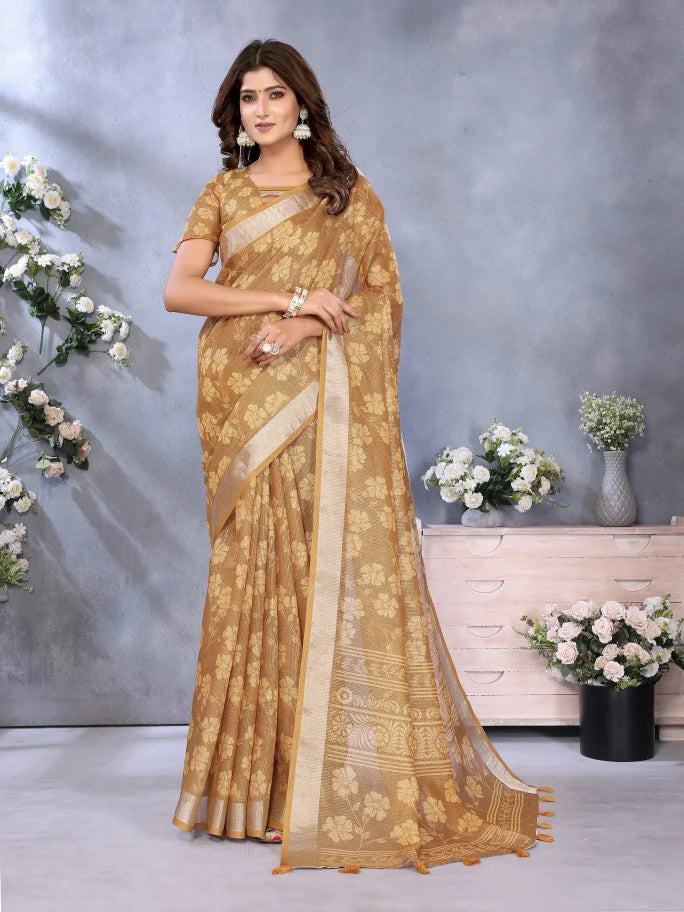 Woman wearing a gold saree with a floral background