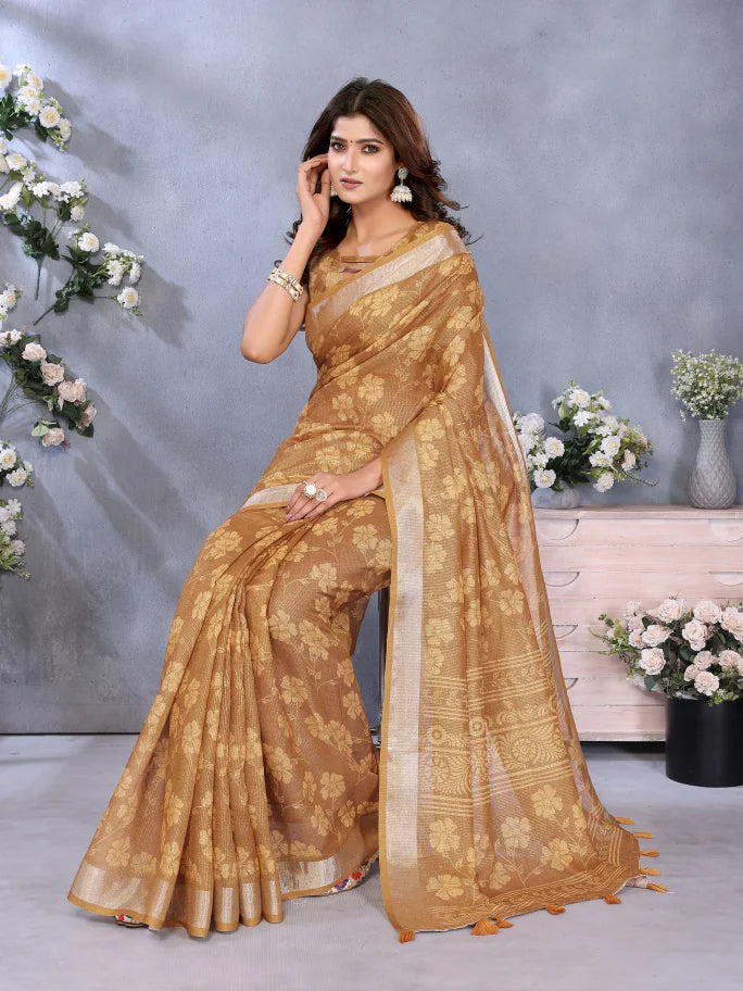 Woman wearing a brown saree with a floral background