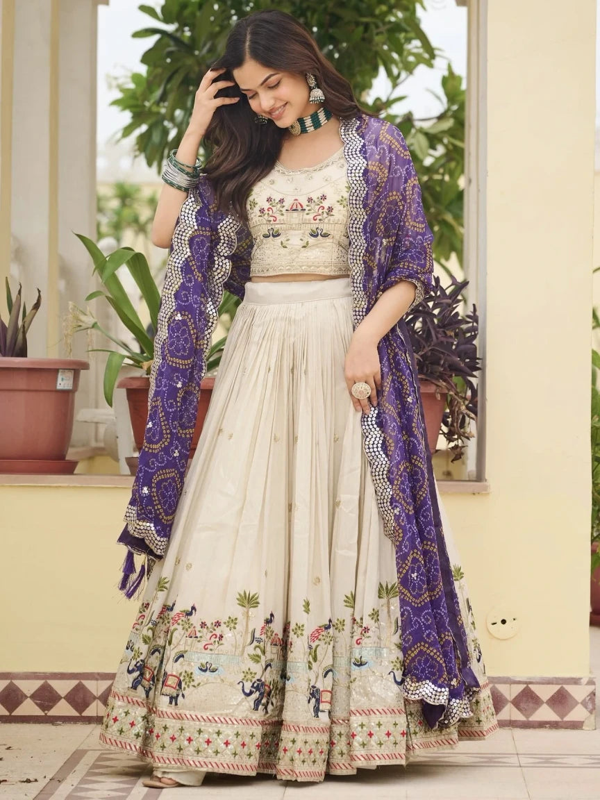Woman in traditional outfit with floral patterns and a purple shawl outdoors.