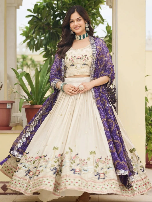 Woman wearing a traditional outfit with a purple shawl in an outdoor setting
