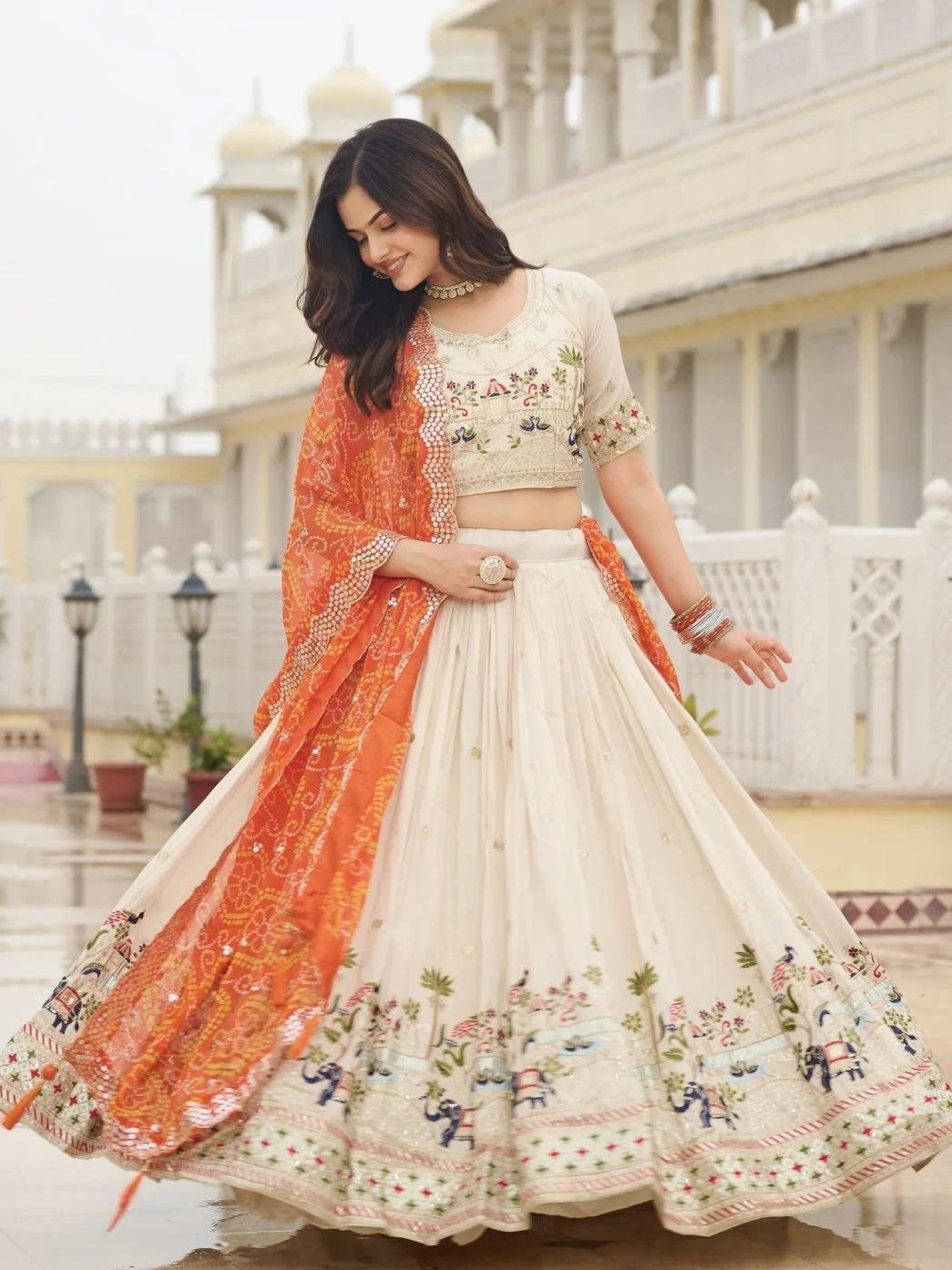 Woman in a traditional outfit with floral patterns in an outdoor setting