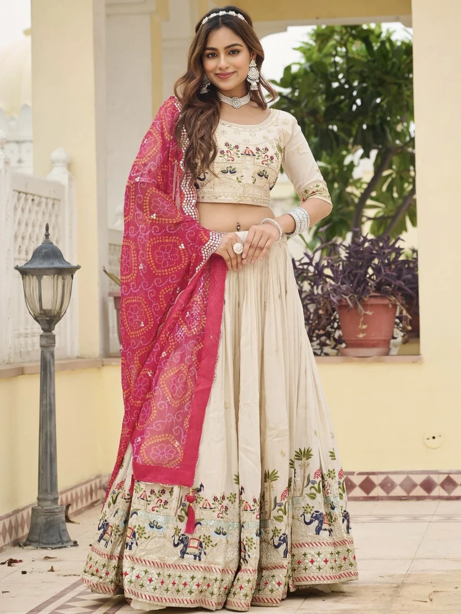 Woman in traditional outfit with pink and white saree in an outdoor setting