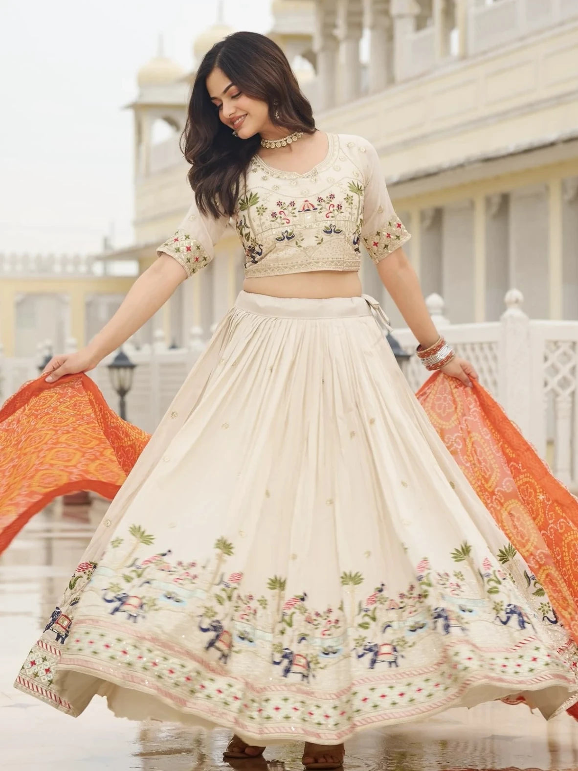Woman in a traditional outfit with floral patterns in an outdoor setting