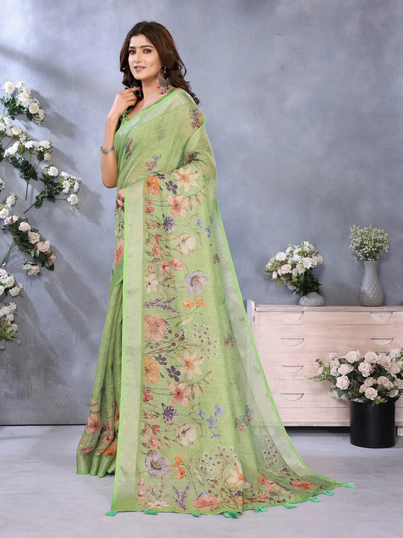 Woman wearing a green floral saree with a gray background and decorative elements.