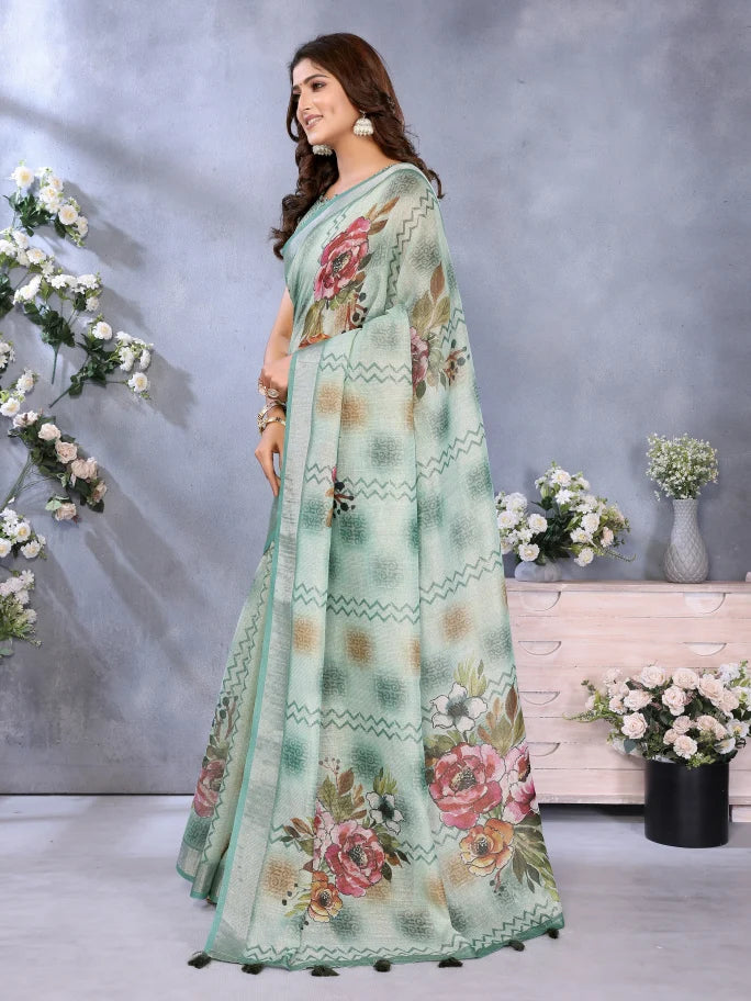 Woman wearing a floral saree with a gray background and decorative elements.