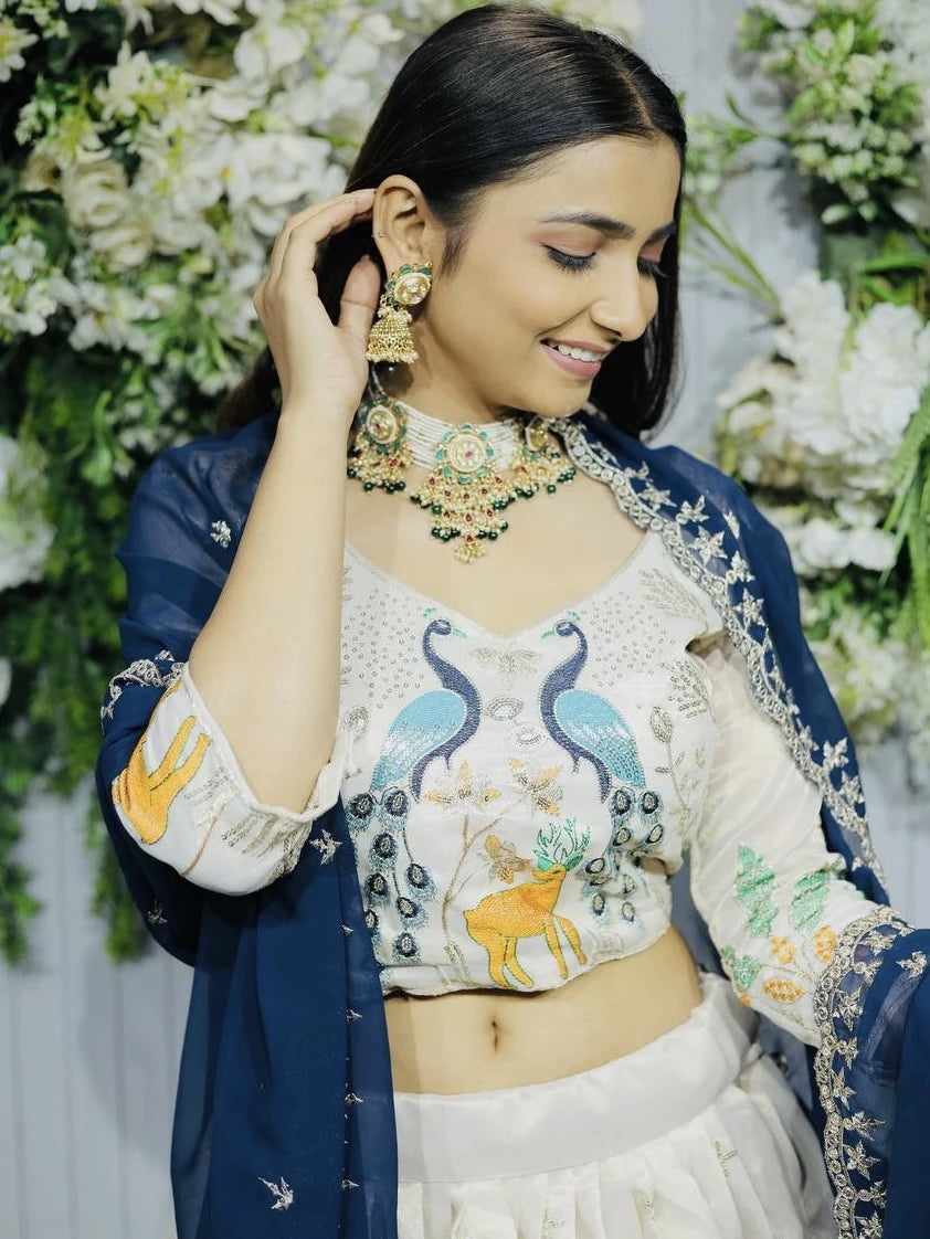 Woman in traditional embroidered outfit with floral background