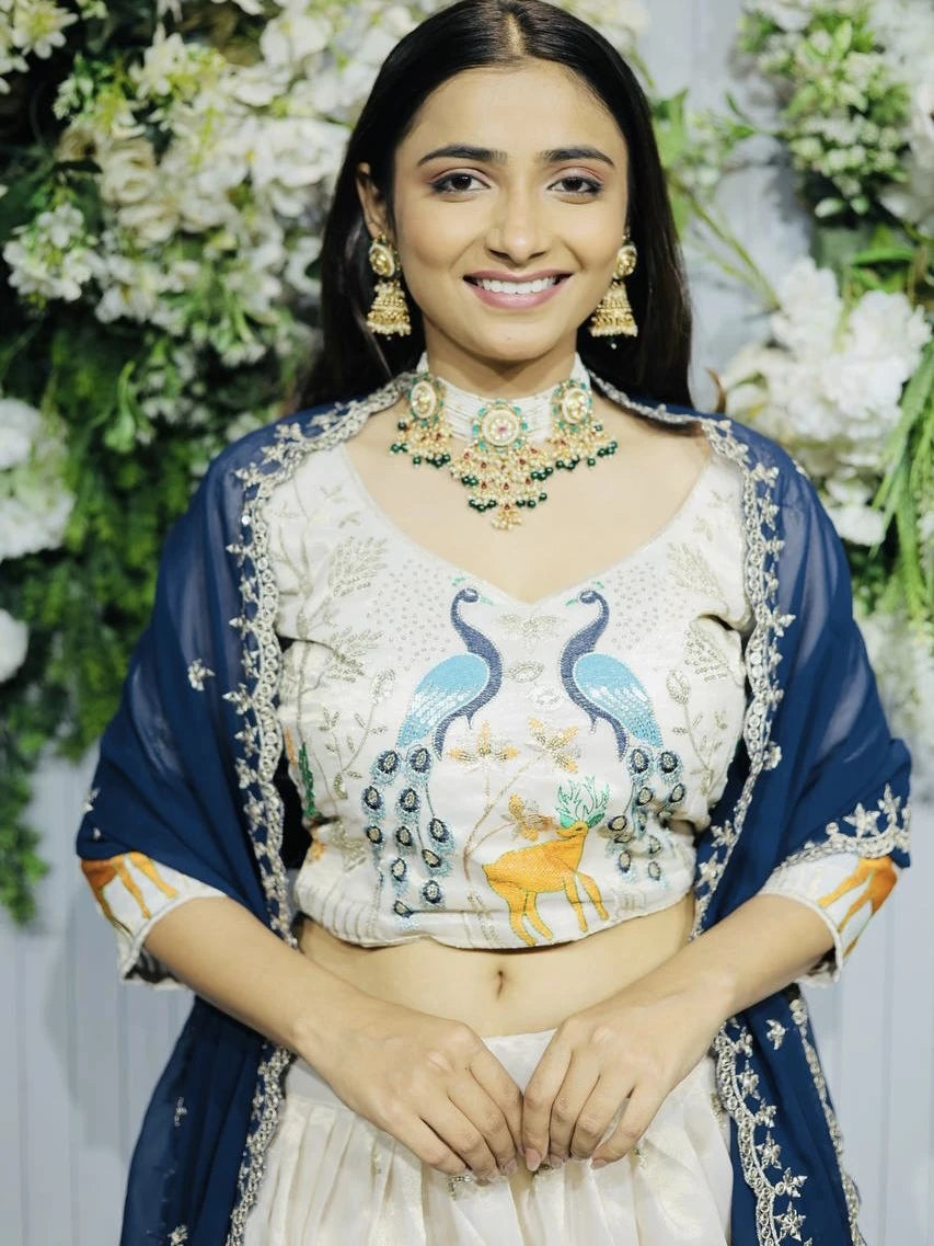 Woman in traditional attire with floral background