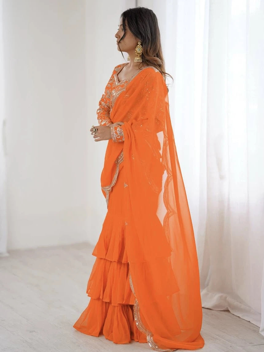 Woman wearing an orange saree with a white background