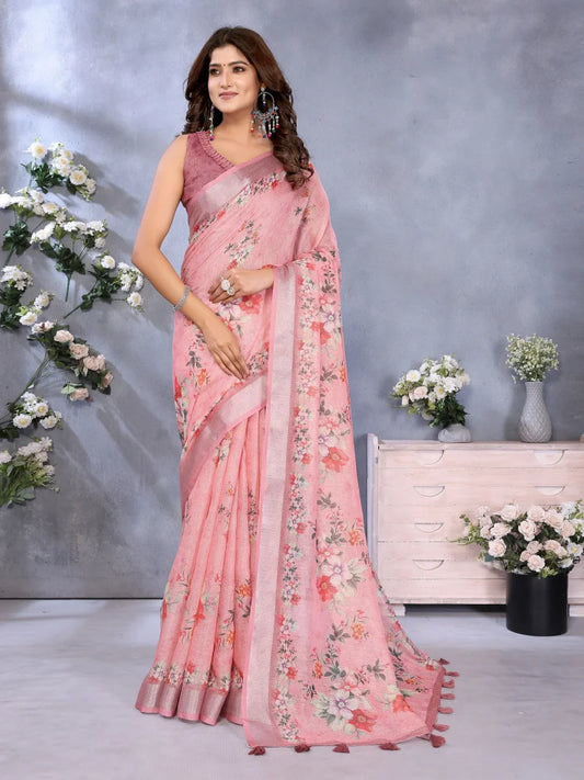 Woman wearing a pink floral saree with a gray background