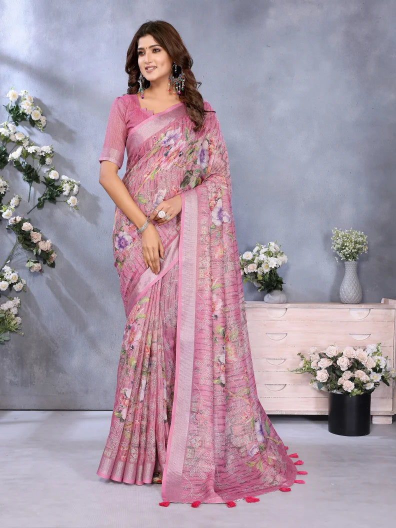Woman wearing a pink floral saree with a gray background and decorative elements.