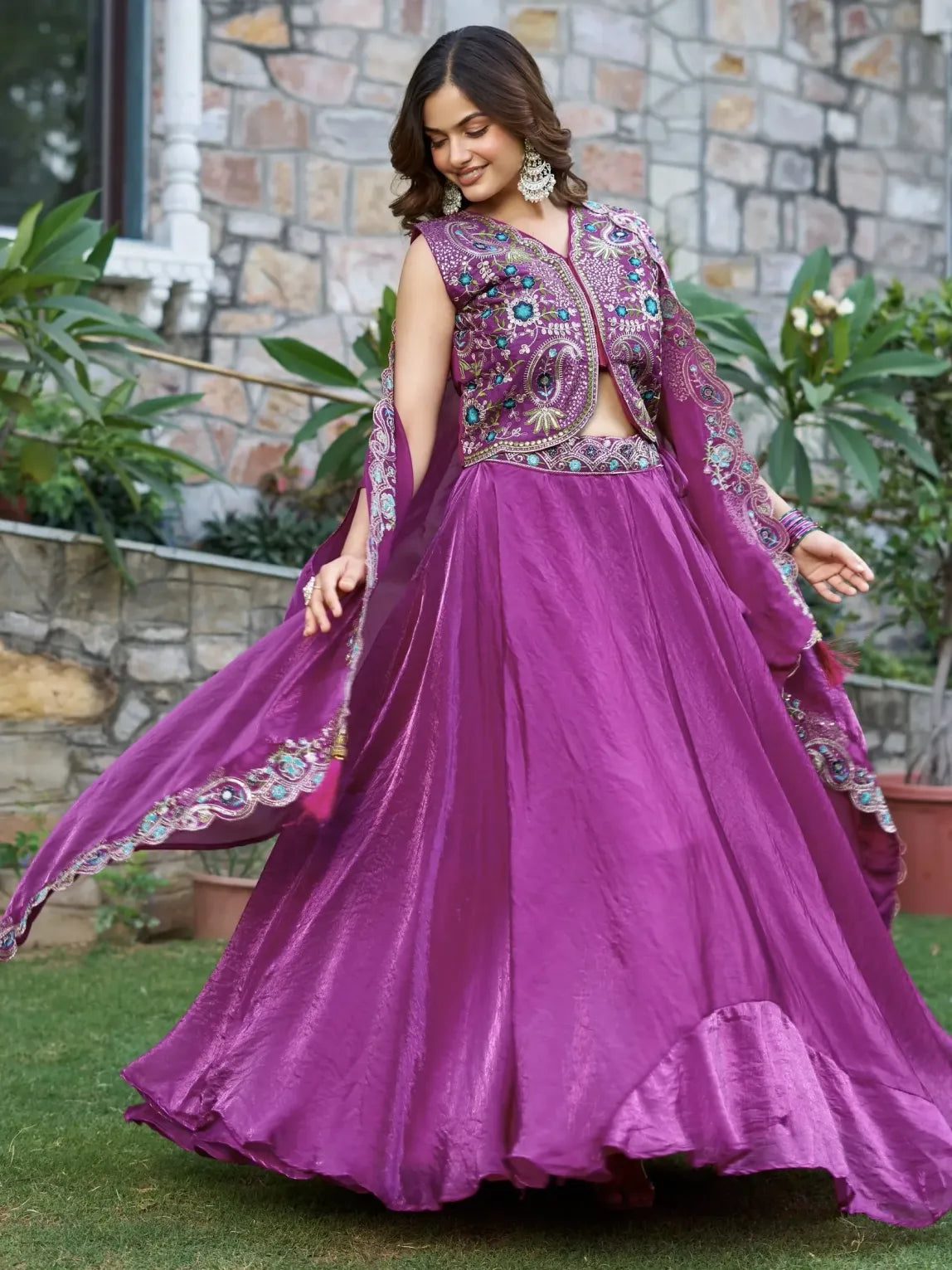 Woman wearing a purple embroidered traditional outfit outdoors.