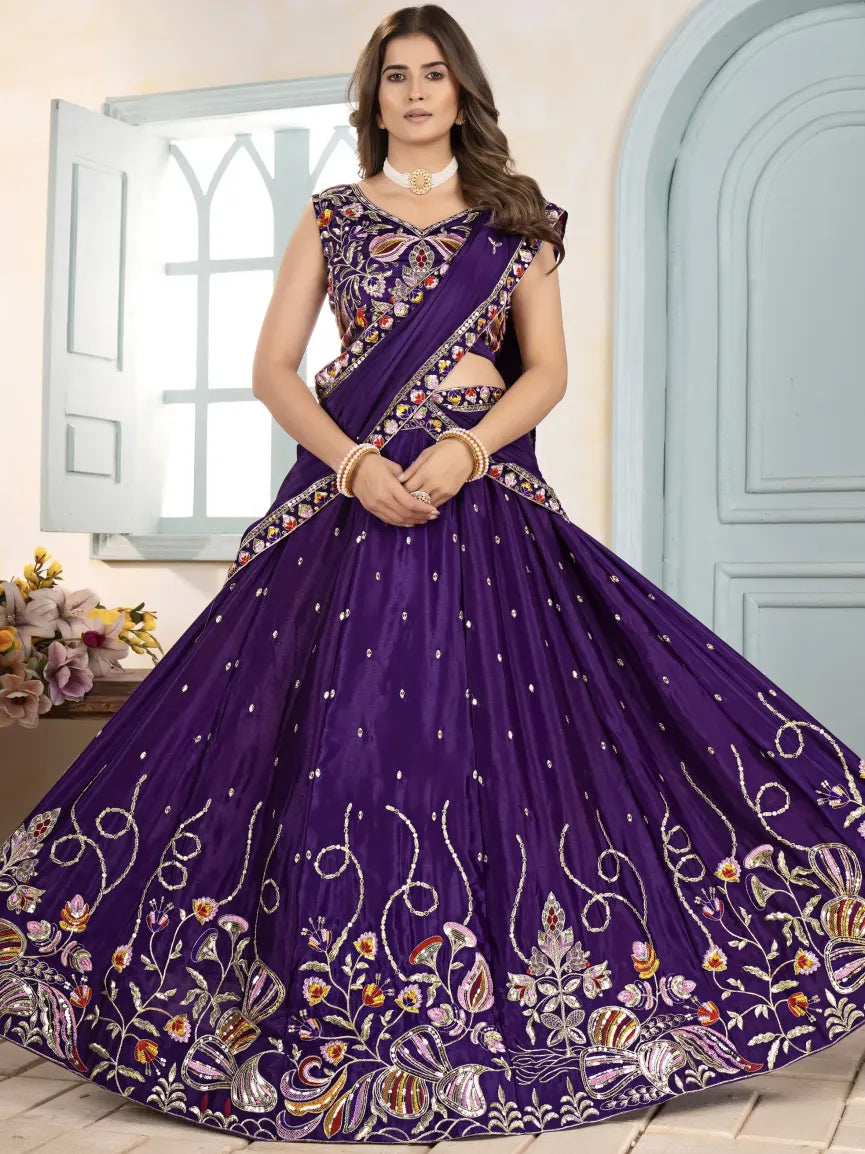 Woman wearing a purple embroidered traditional outfit with a floral design.