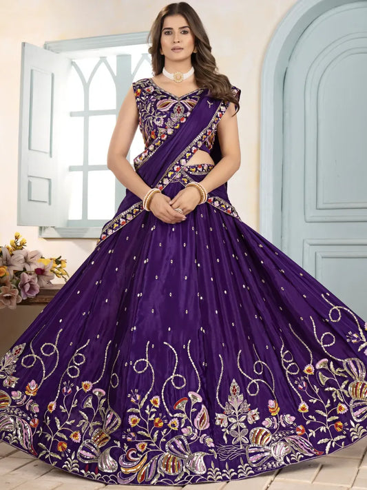 Woman wearing a purple embroidered traditional outfit with a floral design.