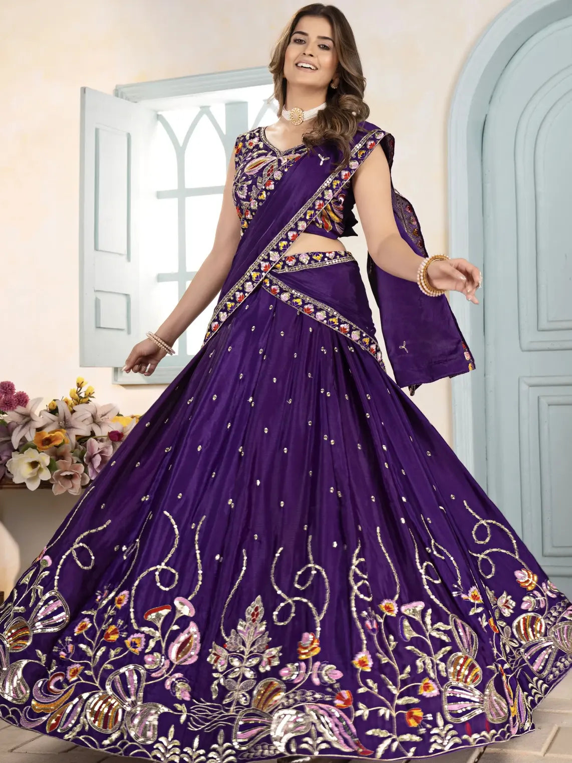 Woman wearing a purple embroidered traditional outfit with a floral background