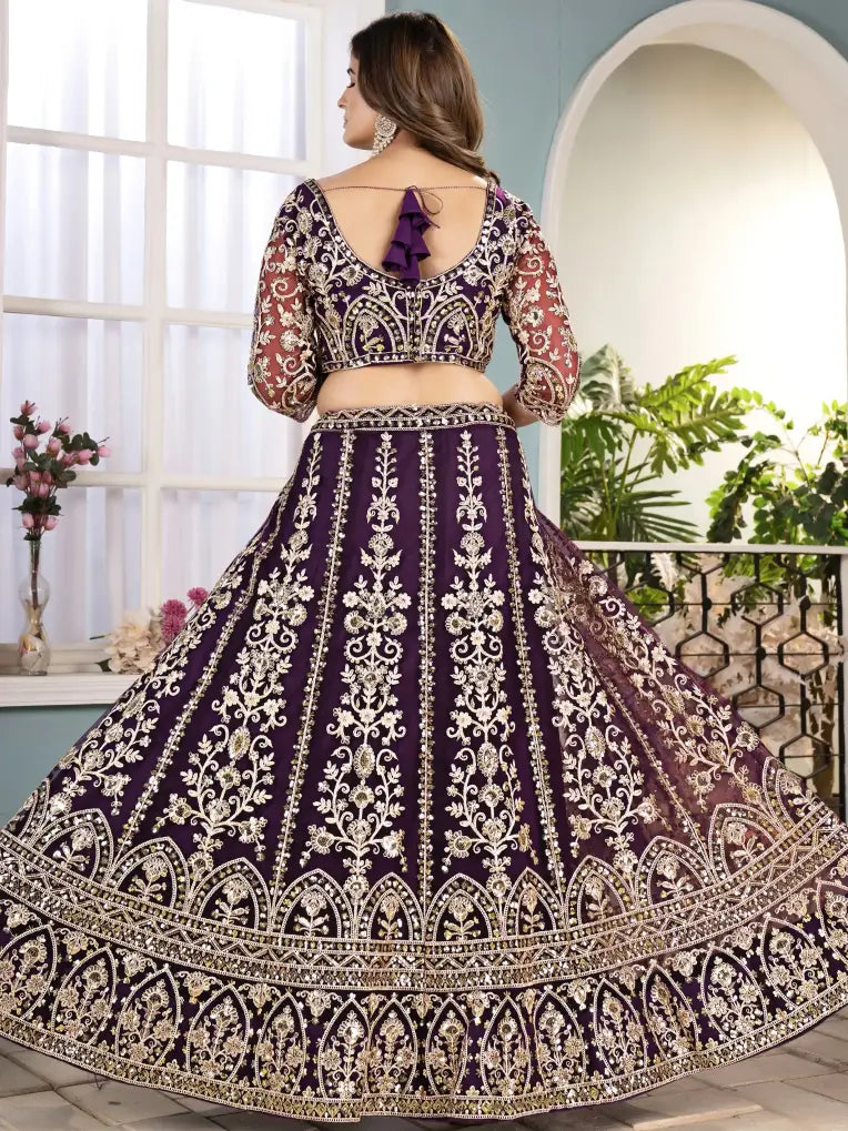 Purple embroidered traditional outfit with a white background