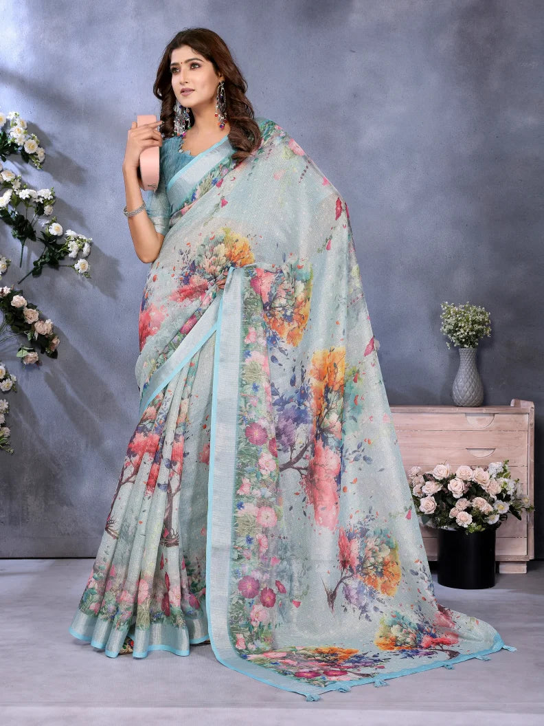 Woman wearing a floral saree with a gray background