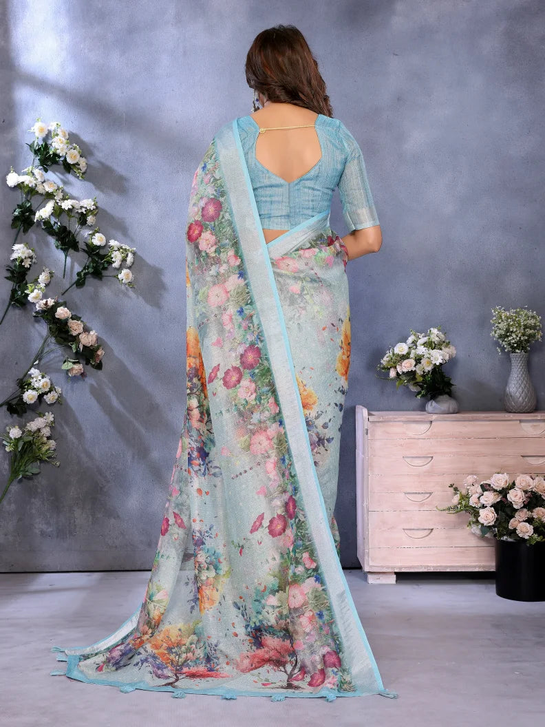 Woman wearing a floral saree with a plain background