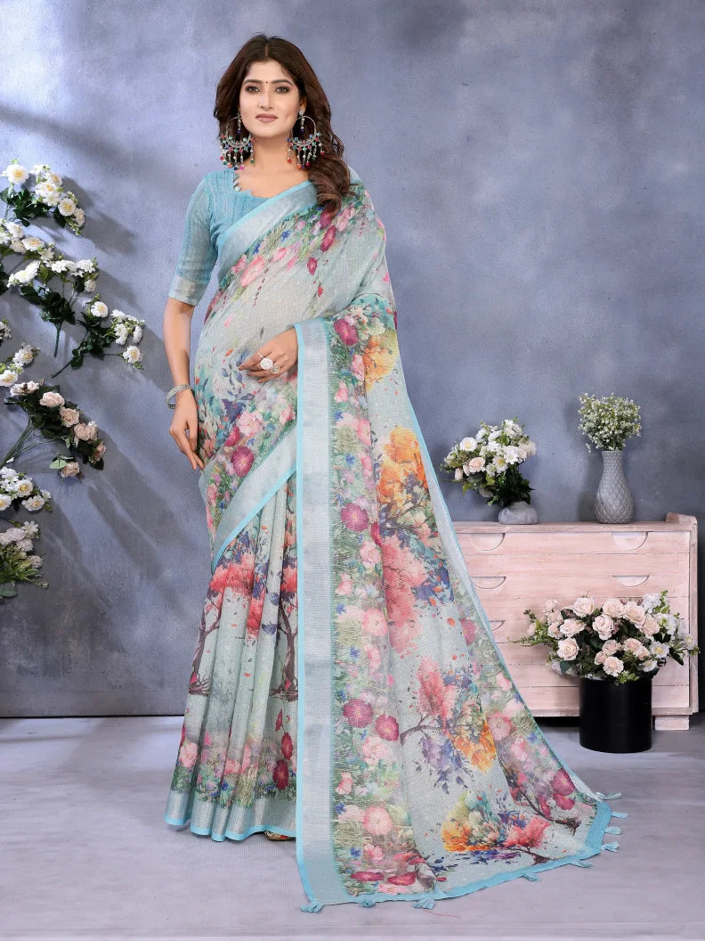 Woman wearing a floral saree with a gray background and decorative elements.