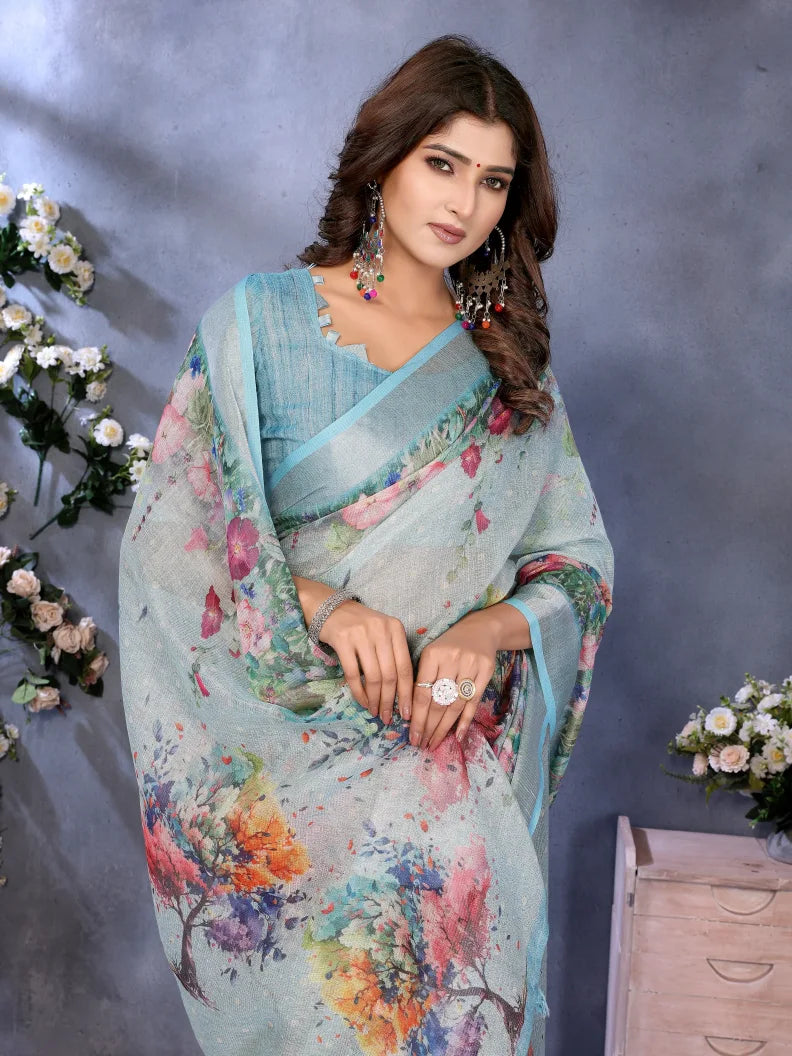 Woman wearing a floral saree with a gray background