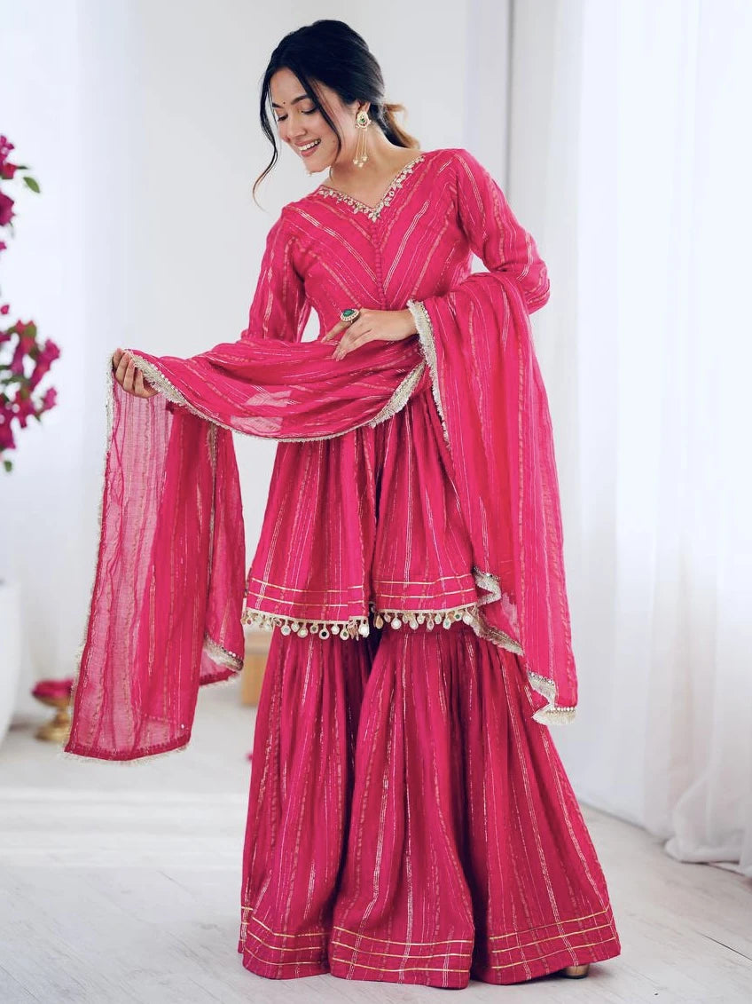 Woman wearing a pink traditional outfit with a white background
