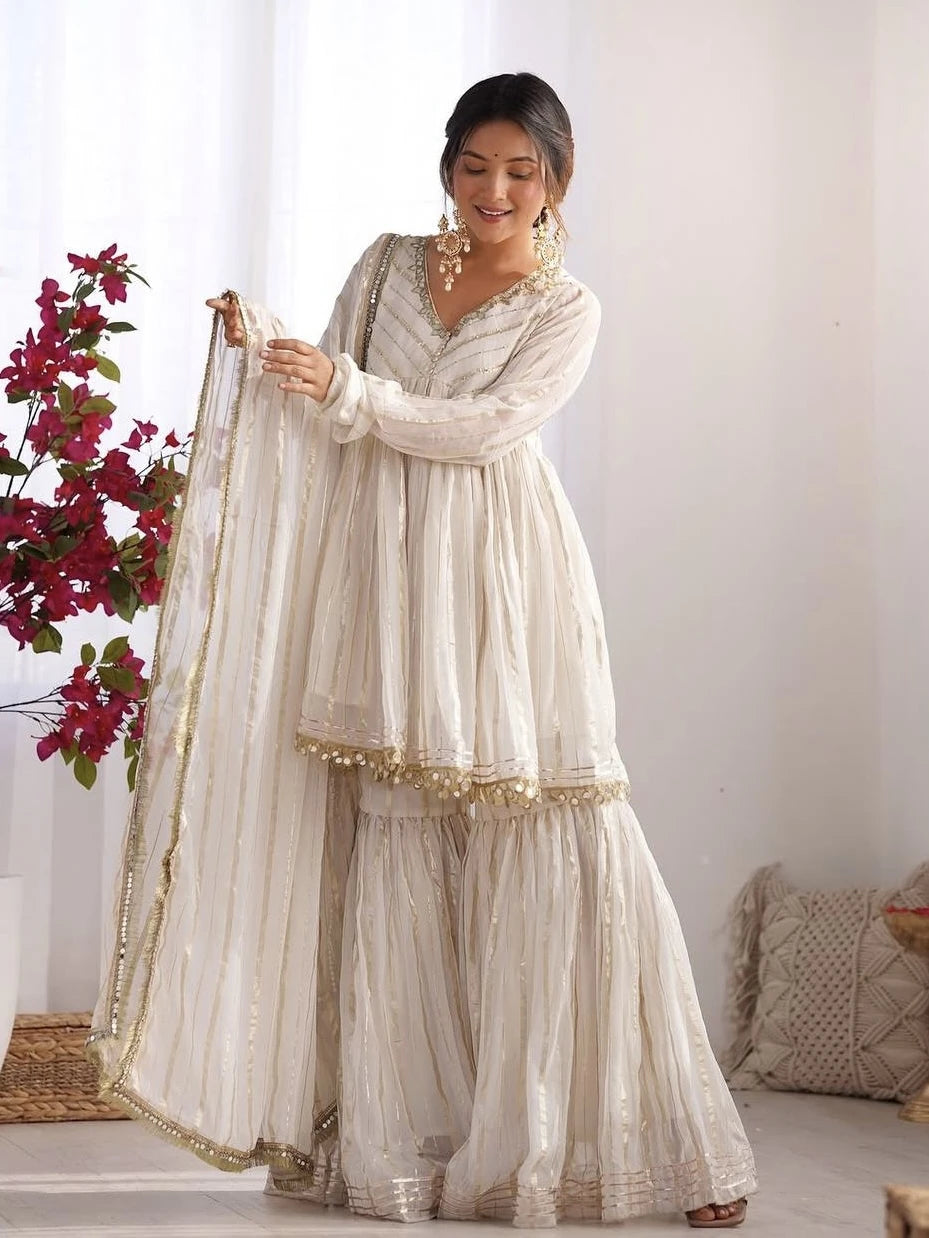Woman in a traditional outfit with a white background